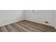Empty bedroom with wood-look floors and a window at 1573 Deerwood Ln, Acworth, GA 30102