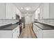Updated kitchen with stainless steel appliances and gray countertops at 1573 Deerwood Ln, Acworth, GA 30102