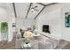 Living room with fireplace, vaulted ceiling, and staged furniture at 1573 Deerwood Ln, Acworth, GA 30102