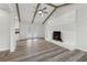 Vaulted ceilings and a fireplace highlight this living room at 1573 Deerwood Ln, Acworth, GA 30102