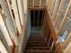 Unfinished basement stairs in new home at 515 Penny Ln, Loganville, GA 30052