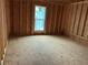 Interior framing of a bedroom with a window, showing construction and layout prior to finishing at 515 Penny Ln, Loganville, GA 30052