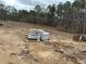 Building materials on a cleared lot, ready for construction at 515 Penny Ln, Loganville, GA 30052