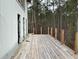 New home features a deck overlooking a wooded area at 515 Penny Ln, Loganville, GA 30052