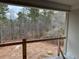 View from a deck under construction, overlooking a wooded area at 515 Penny Ln, Loganville, GA 30052