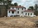 New home under construction with red roof and large windows at 515 Penny Ln, Loganville, GA 30052