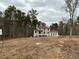 House under construction, red roof, and large windows at 515 Penny Ln, Loganville, GA 30052