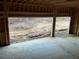 Unfinished three-car garage with wooded views at 515 Penny Ln, Loganville, GA 30052