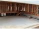 Unfinished garage interior with concrete floor and exposed framing at 515 Penny Ln, Loganville, GA 30052