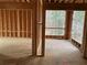 New home construction with large windows overlooking wooded area at 515 Penny Ln, Loganville, GA 30052