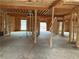 Interior under construction with exposed framing and windows at 515 Penny Ln, Loganville, GA 30052
