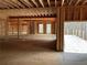 Open floor plan under construction, exposed framing and large windows at 515 Penny Ln, Loganville, GA 30052