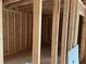 Interior framing showcasing the stud walls, door openings, and structural elements of the unfinished room at 515 Penny Ln, Loganville, GA 30052