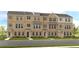 Three-story townhome community with brick facade and landscaping at 233 Lytham Se Dr, Mableton, GA 30126