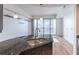 Modern kitchen with granite island and city views at 222 12Th Ne St # 1701, Atlanta, GA 30309