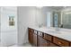 Bathroom boasts dual sink vanity and tiled floor at 250 Lytham Se Dr, Mableton, GA 30126