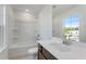 Bright bathroom featuring a bathtub with shower and a single sink at 250 Lytham Se Dr, Mableton, GA 30126