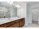 Bright bathroom features a dual sink vanity with a large mirror at 250 Lytham Se Dr, Mableton, GA 30126