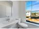 Clean bathroom offers a sink with a large mirror and lots of natural light at 250 Lytham Se Dr, Mableton, GA 30126