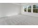 Large bedroom with multiple sunny windows and neutral carpeting at 250 Lytham Se Dr, Mableton, GA 30126