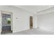 Spacious bedroom features neutral carpet, bright recessed lighting, and an ensuite bathroom at 250 Lytham Se Dr, Mableton, GA 30126