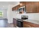 Modern kitchen showcasing stainless steel appliances and white subway tile backsplash at 250 Lytham Se Dr, Mableton, GA 30126