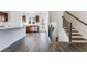 Open-concept kitchen with stainless steel appliances, granite countertops, and hardwood floors at 250 Lytham Se Dr, Mableton, GA 30126