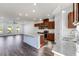 Well-lit kitchen featuring modern appliances, center island, and seamless flow to the living area at 250 Lytham Se Dr, Mableton, GA 30126