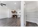 View of pantry, kitchen, and living room with open-concept layout and abundant natural light at 250 Lytham Se Dr, Mableton, GA 30126