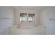 Bright bathroom with a soaking tub surrounded by marble, and a window overlooking the outdoor living space at 731 Willow Ridge Dr, Marietta, GA 30068