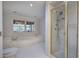 Bright bathroom featuring a bathtub, a shower and natural light at 731 Willow Ridge Dr, Marietta, GA 30068
