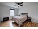 Cozy bedroom with hardwood floors, a ceiling fan, and a double bed at 731 Willow Ridge Dr, Marietta, GA 30068