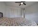 Bright bedroom with hardwood floors, ceiling fan, and closet at 731 Willow Ridge Dr, Marietta, GA 30068