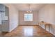 Dining room with hardwood floors, large window, and modern chandelier at 731 Willow Ridge Dr, Marietta, GA 30068