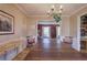 Spacious dining room with hardwood floors, wainscoting and a view to the living room at 731 Willow Ridge Dr, Marietta, GA 30068