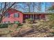 Charming home with a covered porch, dark shutters, and a lush front yard, offering a welcoming curb appeal at 731 Willow Ridge Dr, Marietta, GA 30068