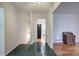 Foyer with black tile flooring leading to the living areas and kitchen at 731 Willow Ridge Dr, Marietta, GA 30068