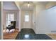 Charming Foyer featuring black tile floor, a decorative front door, and hardwood floors at 731 Willow Ridge Dr, Marietta, GA 30068