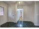 The foyer features black tiled floor and a glimpse into the living spaces at 731 Willow Ridge Dr, Marietta, GA 30068