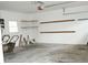 Spacious garage with concrete floors, open shelving, and ample space for vehicles and storage at 731 Willow Ridge Dr, Marietta, GA 30068