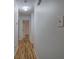 Hallway with wooden floors connecting different areas of the house at 731 Willow Ridge Dr, Marietta, GA 30068