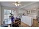 Bright kitchen with white cabinets, countertop, island with adjacent table, and modern appliances at 731 Willow Ridge Dr, Marietta, GA 30068