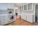 Well-maintained kitchen features white cabinets, a vintage oven, and plenty of storage with hardwood floors at 731 Willow Ridge Dr, Marietta, GA 30068