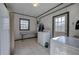 Functional laundry room with tile floors, ample cabinet space, and an exterior door at 731 Willow Ridge Dr, Marietta, GA 30068