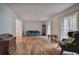 Spacious living room featuring hardwood floors, neutral paint, large windows, and tasteful furniture at 731 Willow Ridge Dr, Marietta, GA 30068