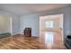 Living Room boasts gleaming wood floors and access to the dining room with grand windows at 731 Willow Ridge Dr, Marietta, GA 30068