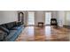 Spacious living room featuring hardwood floors, large windows and comfortable seating at 731 Willow Ridge Dr, Marietta, GA 30068