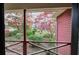 Enjoy the view from the porch, showcasing a serene, landscaped yard with trees and colorful azaleas at 731 Willow Ridge Dr, Marietta, GA 30068