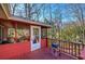 Red screened porch with a grill, a seating area, and lots of natural light offering a calming view at 731 Willow Ridge Dr, Marietta, GA 30068