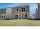 A sprawling backyard with lush green grass, a covered patio and well maintained lawn at 4311 Portsbrook Ave, Snellville, GA 30039